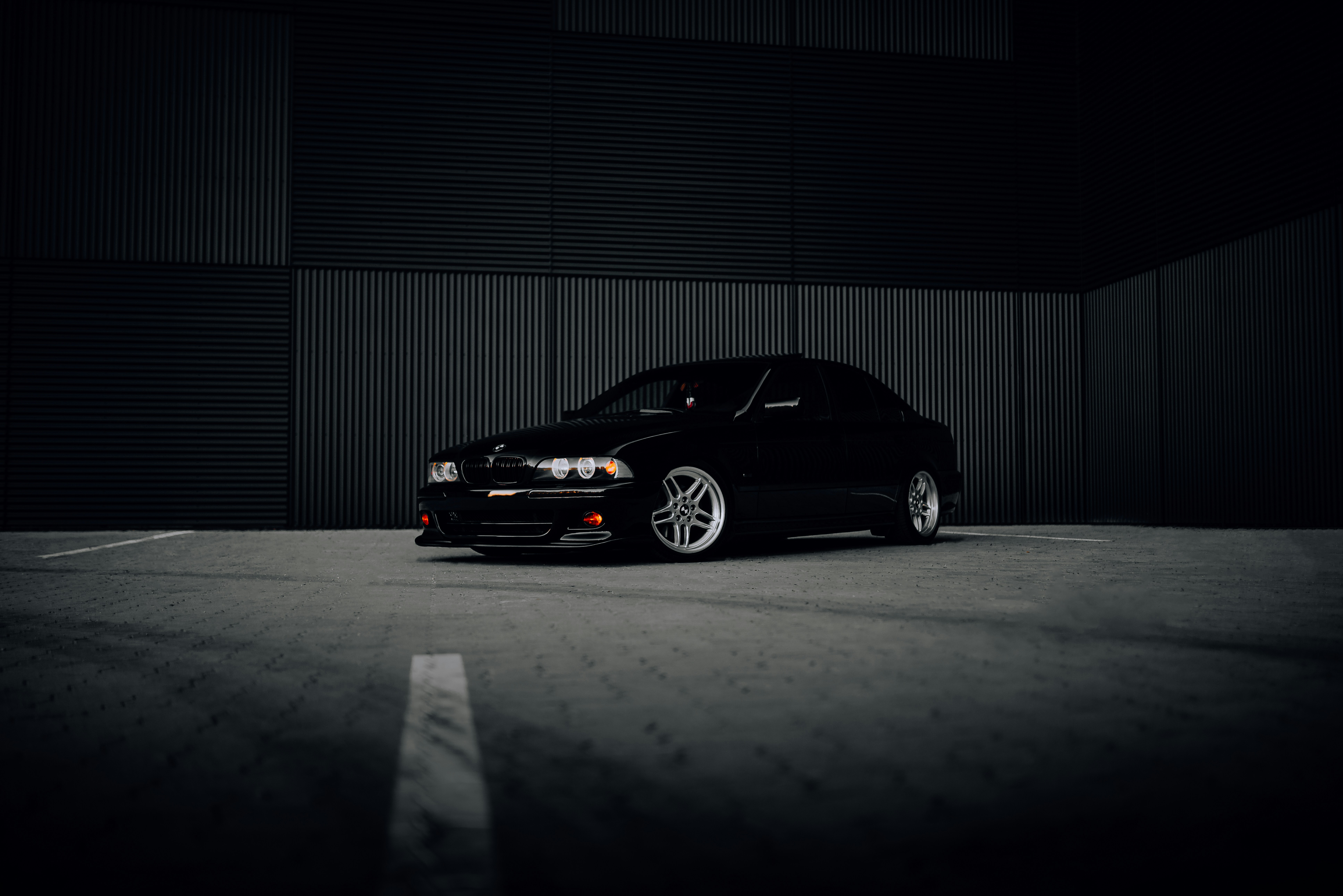 a black car parked in a garage